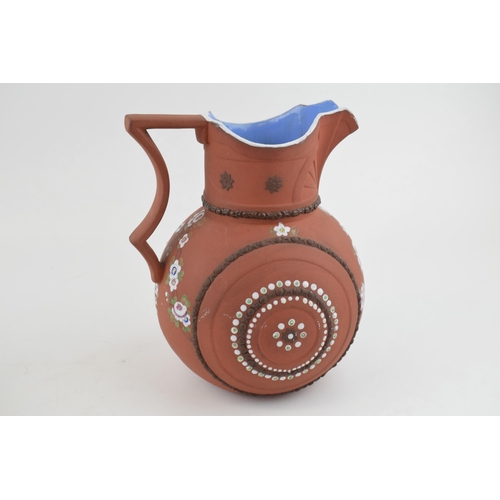 88 - An early 19th century moulded stoneware terracotta G R Booth jug, c. 1839. It has hand-painted flowe... 