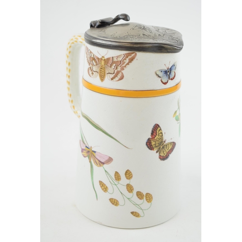 91 - A mid to late 19th century pottery jug with hinged lid, printed and painted with hummingbirds and bu... 