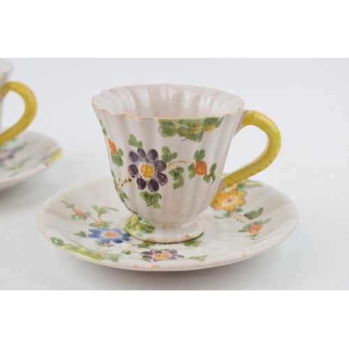 99 - A pair of early 20th century Italian Cantagalli faience tin-glazed pottery cups and saucers, c. 1900... 