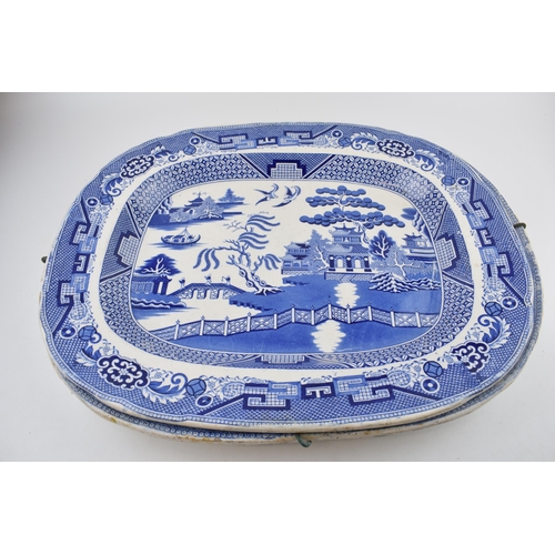 112 - A group of 19th century blue and white pottery Willow pattern platters and other similar. (q)