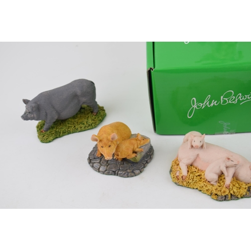 173 - A boxed Beswick Help for Heroes soldier with a collection of Royal Doulton resin pigs (7).