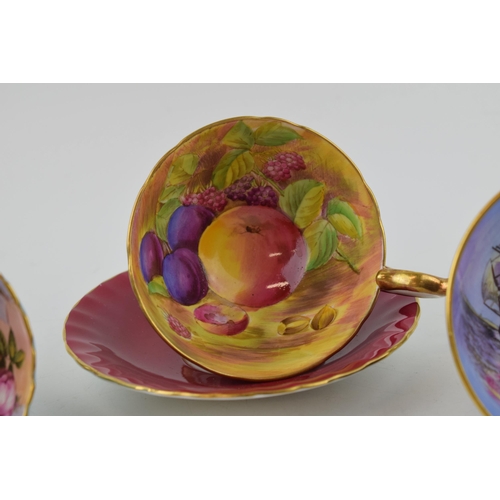 246 - A collection of Aynsley hand painted cups to include an Orchard Gold cup and saucer, another cup wit... 