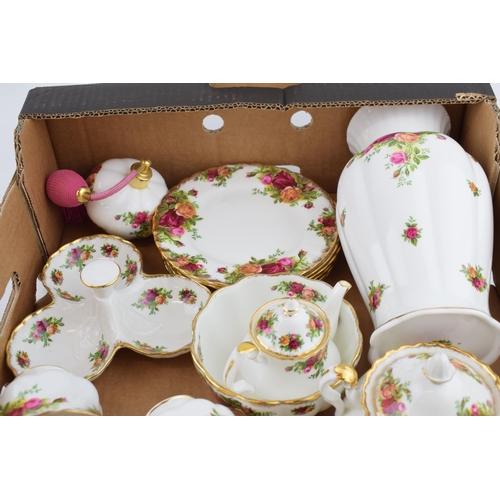 251 - Royal Albert Old Country Roses to include an extra small teapot, a pair of ribbed vases, 6 trios, a ... 