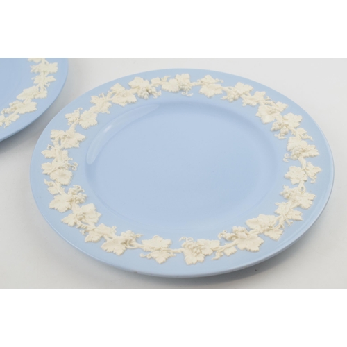 264 - A pair of Wedgwood Queensware dinner plates, 27cm diameter, white on blue (2).