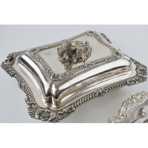 297 - A good quality pair of silver plated entree dishes, with ornate decoration, one by Walker and Hall (... 