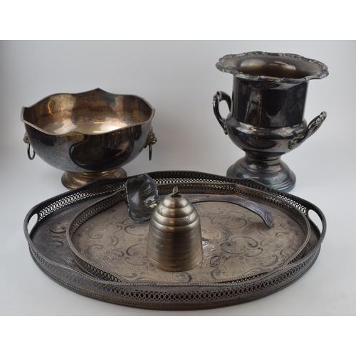 302 - A collection of silver-plated items to include trays, an urn and a bowl, largest 27cm tall.