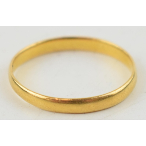 309 - A 22 ct yellow gold wedding band. Weight 2.1 grams.