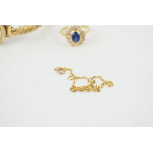 313 - A collection of 9ct gold items to include a ladies ring set with a central sapphire, a rope chain, a... 