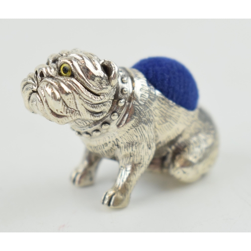 325 - Sterling silver pin cushion in the form of a bulldog, with blue velvet cushion, 30mm wide.