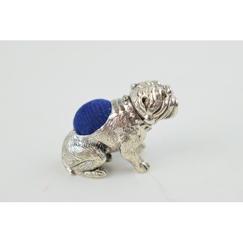 325 - Sterling silver pin cushion in the form of a bulldog, with blue velvet cushion, 30mm wide.