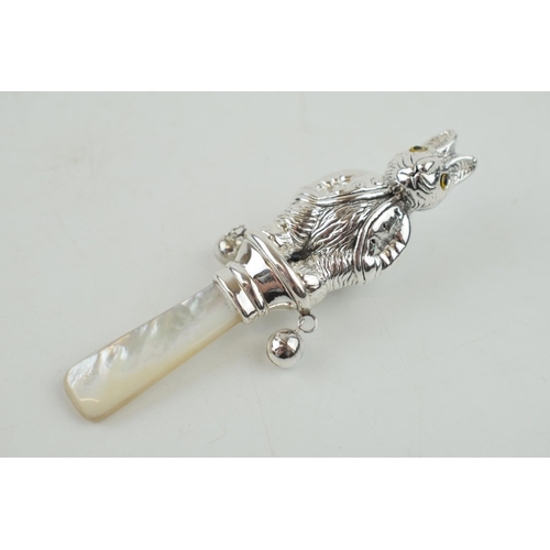 326 - Sterling silver baby rattle, with mother of pearl, in the form of a Beatrix Potter style character, ... 