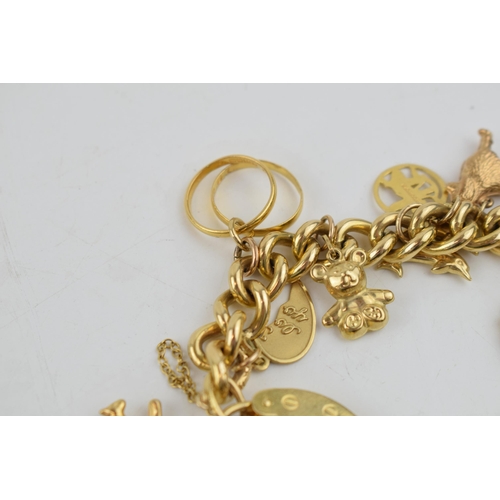 331 - 9ct yellow gold charm bracelet with padlock clasp and safety chain. To include 14 individual charms ... 