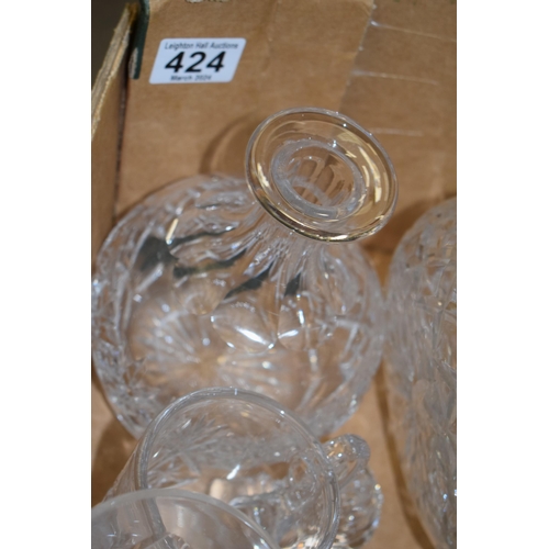 424 - A good collection of cut glass and crystal items to include decanters, jugs, bowls and others (Qty -... 