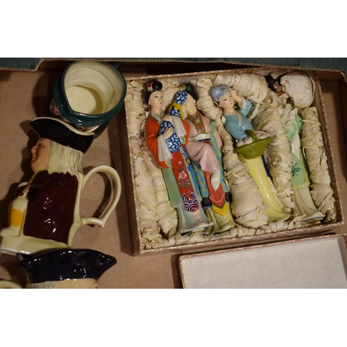 431 - A mixed collection of items to include Toby Jugs in varying sizes, a boxed set of oriental figures, ... 