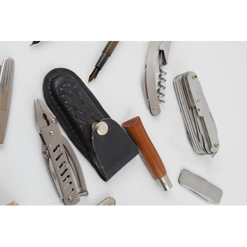 473 - A collection of vintage penknives to include examples by Victorinox, together with a collection of v... 