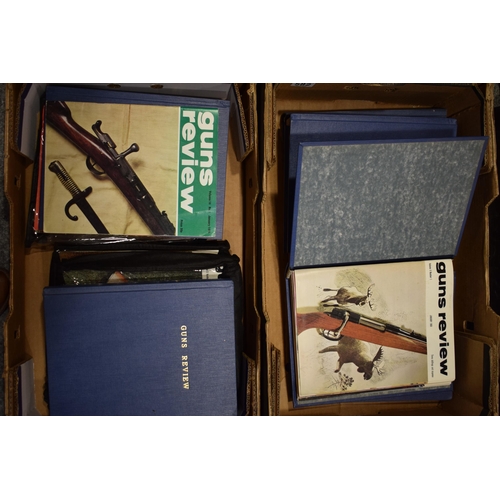 582 - Guns and Review bound magazine editions from the 1960s and 1970s. Large quantity in two trays.