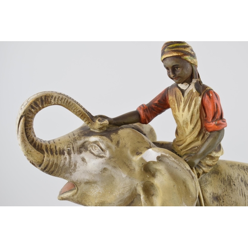 444 - A large mid 20th century plaster bust of an Indian boy riding an elephant, with registration number ... 