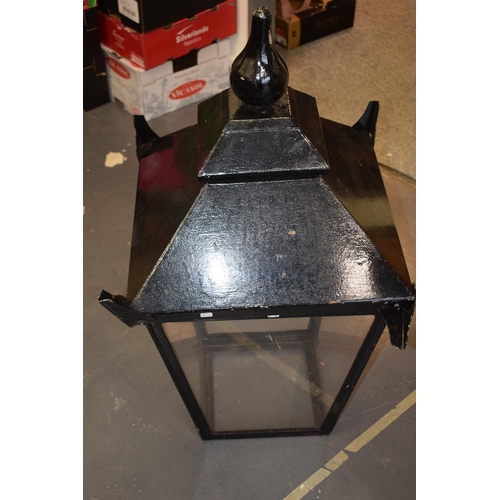 455 - A reproduction pub style lamp with perspex glass on three sides. (one side missing) Height 94cm.