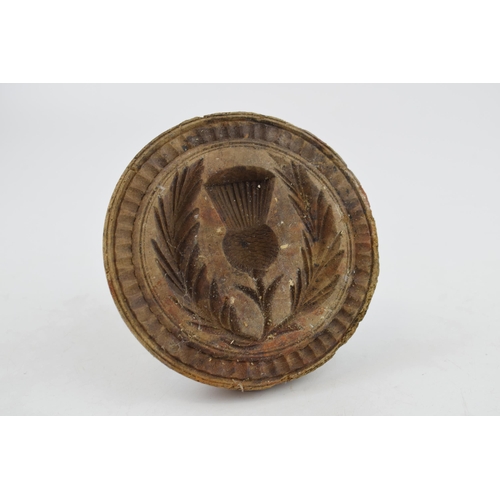 480 - Vintage treen butter stamp with thistle decoration, 12cm diameter.