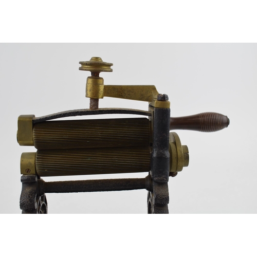 481 - Victorian table top cuff and collar mangle, mounted onto wooden base, 26cm long.