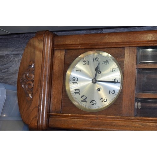 484 - Early - mid 20th century wall clock with chiming movement. Pendulum and key present. Height 78cm.