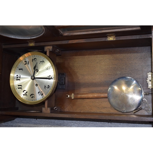 484 - Early - mid 20th century wall clock with chiming movement. Pendulum and key present. Height 78cm.