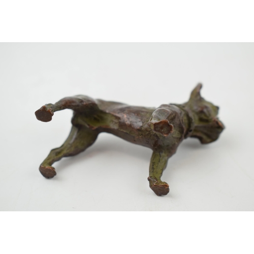 485 - A contemporary bronzed sculpture of a bulldog standing four square, 7cm long.