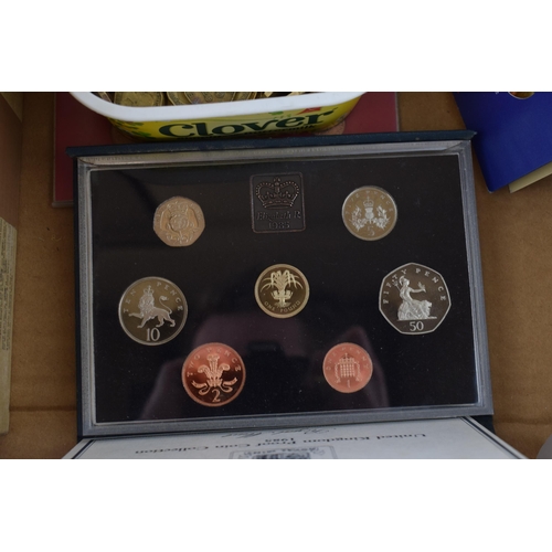 488 - Coins to include a boxed 1985 United Kingdom boxed proof set, 200+ 3 pence pieces, a UK uncirculated... 