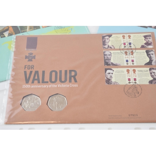 495 - A collection of 11 First Day Covers, with 50p coins, to include World Heritage Sites, For Valour, Pr... 