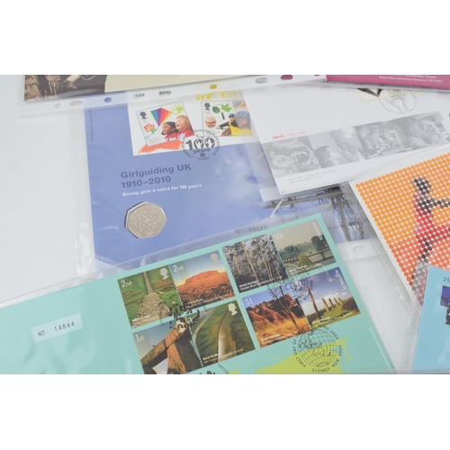 495 - A collection of 11 First Day Covers, with 50p coins, to include World Heritage Sites, For Valour, Pr... 