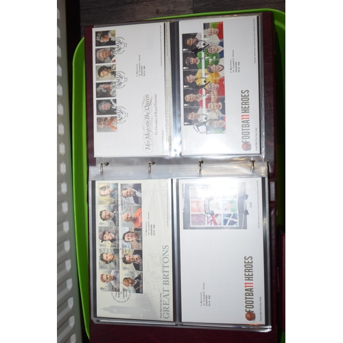 497 - A large and extensive collection of Royal Mail First Day Covers, in red leather bound albums, to inc... 