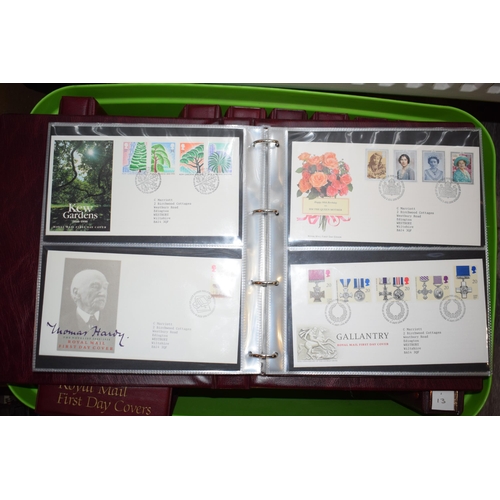 497 - A large and extensive collection of Royal Mail First Day Covers, in red leather bound albums, to inc... 