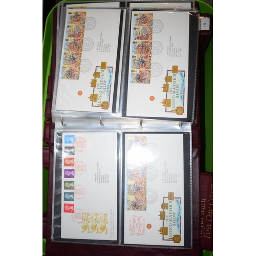 497 - A large and extensive collection of Royal Mail First Day Covers, in red leather bound albums, to inc... 