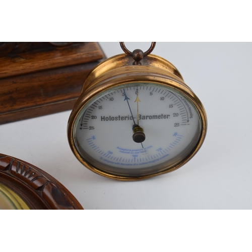 510 - A barometer with thermometer on round wooden mount diameter 22cm together with a 'Dew Point' gauge a... 