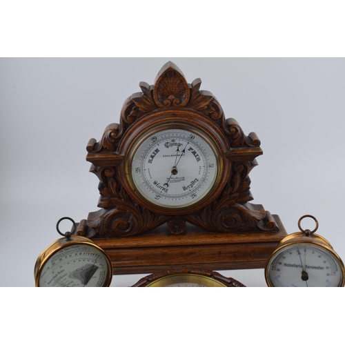 510 - A barometer with thermometer on round wooden mount diameter 22cm together with a 'Dew Point' gauge a... 