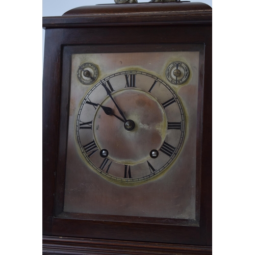 512 - Mahogany case mantle clock with pendulum chiming movement marked W&H SCH. With pendulum and key. Cas... 