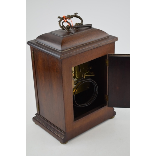 512 - Mahogany case mantle clock with pendulum chiming movement marked W&H SCH. With pendulum and key. Cas... 