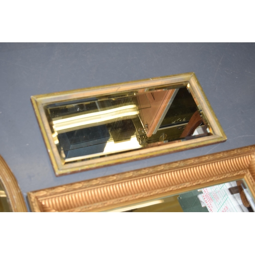 514 - 3 gilt framed antique mirrors with bevelled glass. To include a rectangular example with classical s... 