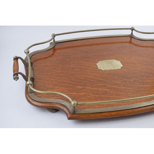 515 - Golden oak tea-tray with silver-plated rail and handles. Sitting on original ball feet. Silver-plate... 