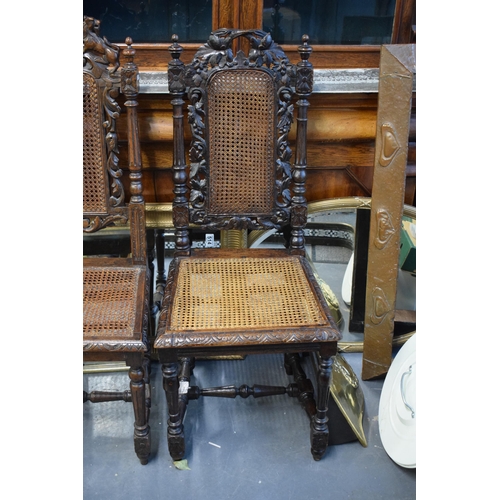 517 - Two hand-carved oak Elizabethan style chairs, one with with floral and naturalist leaf decoration an... 