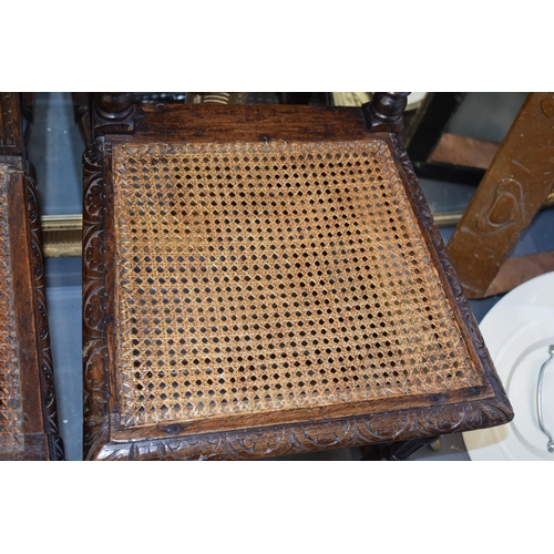 517 - Two hand-carved oak Elizabethan style chairs, one with with floral and naturalist leaf decoration an... 