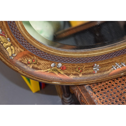 518 - Antique decorative oval shaped mirror with oriental inlaid gilt decoration. Bevelled glass. 87cm x 5... 