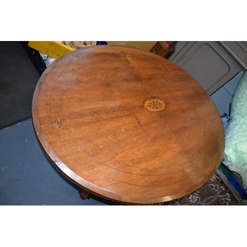 521 - Victorian quarter veneered burr walnut oval table with ornately carved legs on casters, satinwood in... 