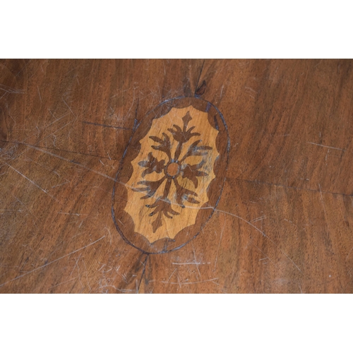 521 - Victorian quarter veneered burr walnut oval table with ornately carved legs on casters, satinwood in... 