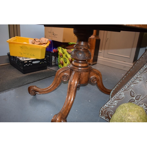 521 - Victorian quarter veneered burr walnut oval table with ornately carved legs on casters, satinwood in... 