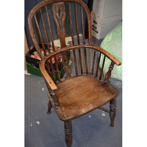 522 - Early Victorian elm and ash windsor chair, spindle back, shaped saddle seat, 98cm tall.