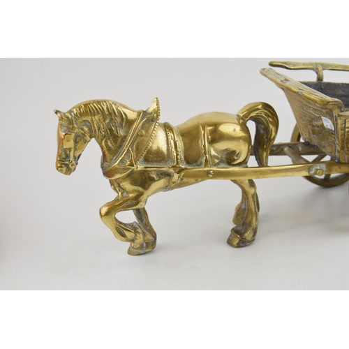 536 - A vintage brass horse and cart. Cart with moving wheels. Weighing over 5KG. Length 46cm, height 17cm... 