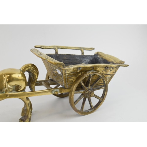 536 - A vintage brass horse and cart. Cart with moving wheels. Weighing over 5KG. Length 46cm, height 17cm... 