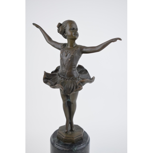 545 - A spelter figure mounted onto a marble base in the form of a ballet dancer, 32cm tall, indistinctly ... 