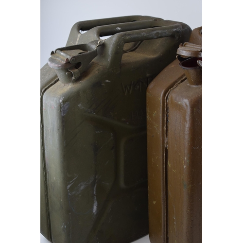 559 - A pair of World War Two British Army jerry cans, both dated 1945, 46cm tall (2).